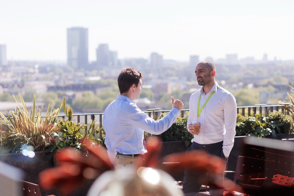 Founders connecting on the Ignite London rooftop terrace