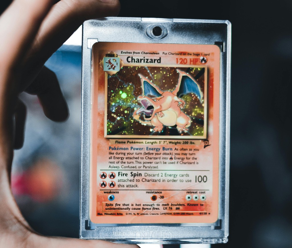 AI card centering analysis applied to a holographic 1st Edition Charizard Pokémon card — pregrading scan tracing the outer slab border and inner card edges to measure left, right, top and bottom margins.