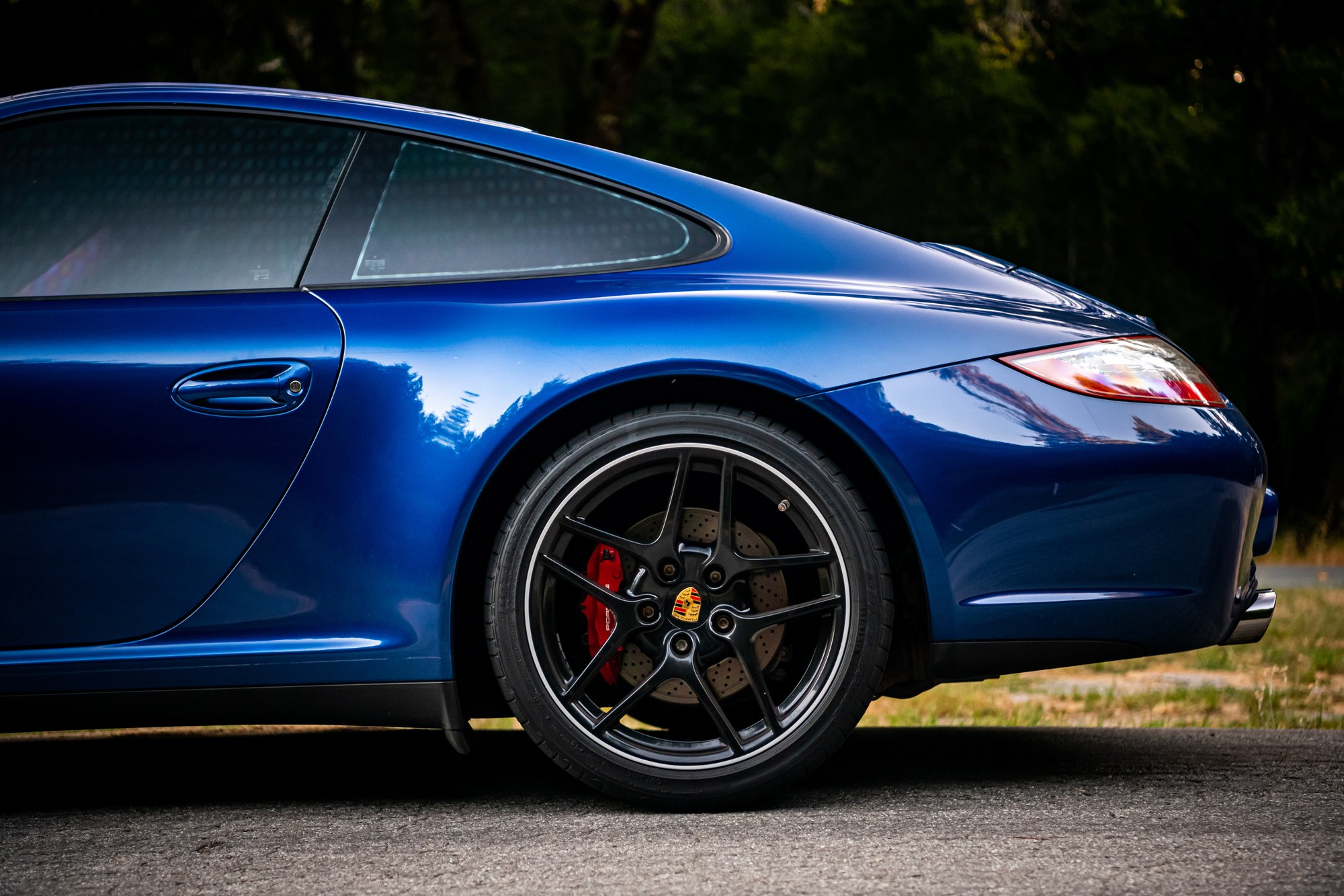 Porsche 911 C4S rear three-quarter view in blue, automotive photography by Sharplite Media, Bay Area