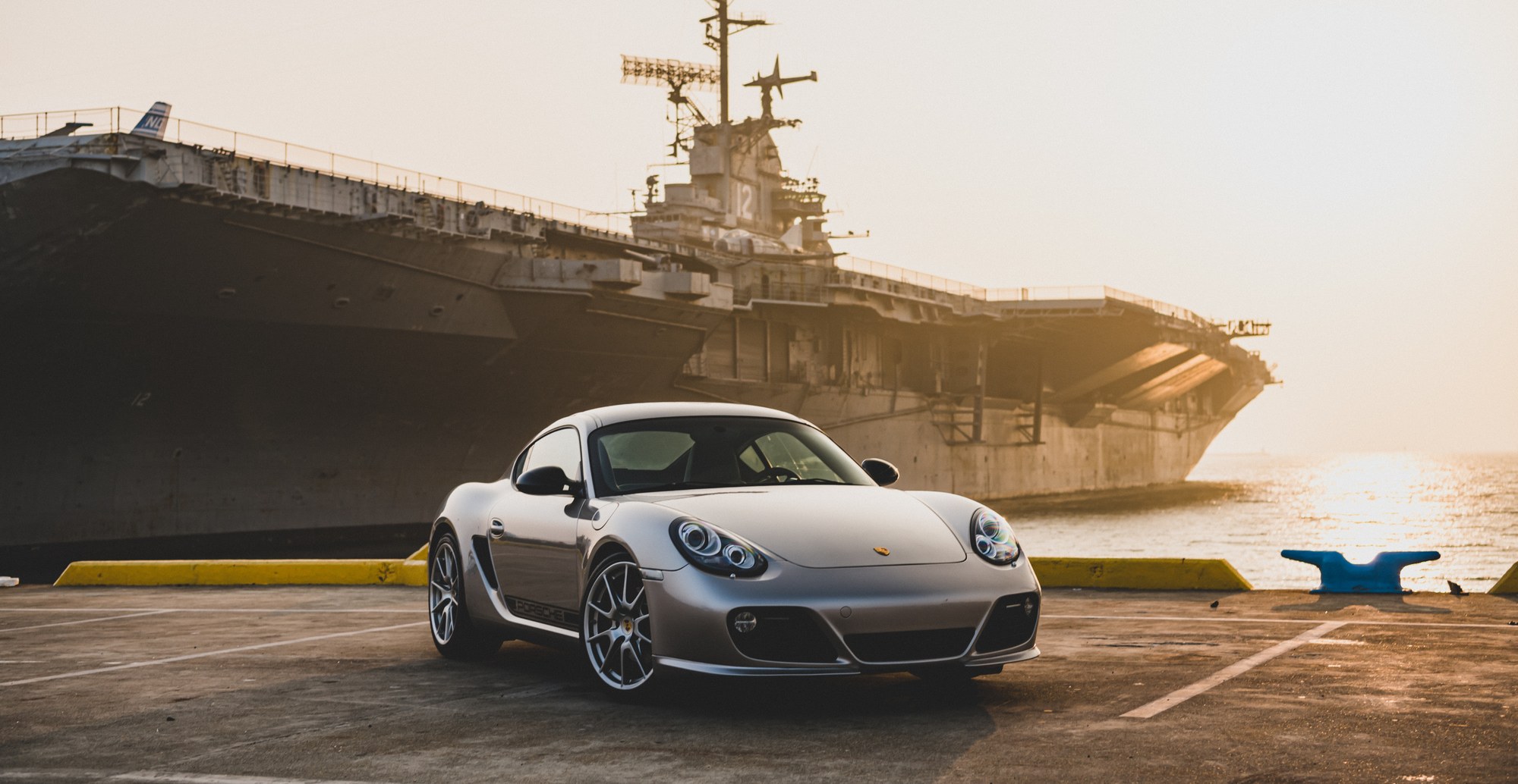 Porsche Cayman R photographed at a shipyard, location automotive photography by Sharplite Media, Bay Area