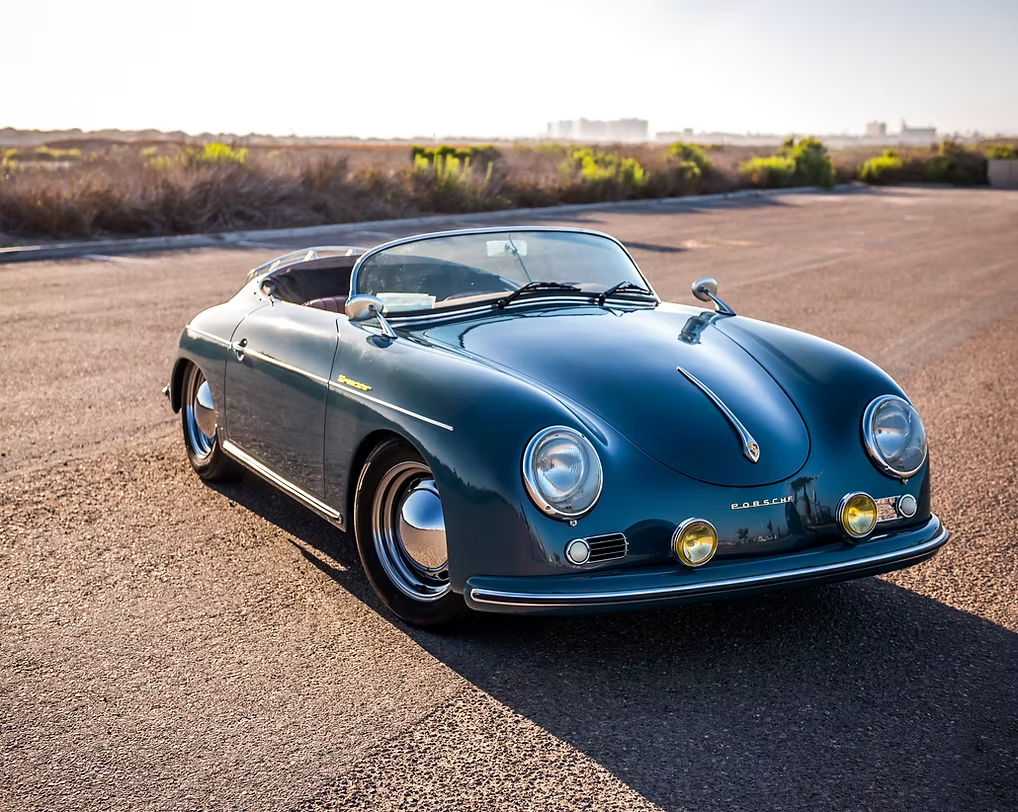 Porsche Speedster photographed at sunset against a city skyline, golden-hour automotive photography by Sharplite Media, Bay Area