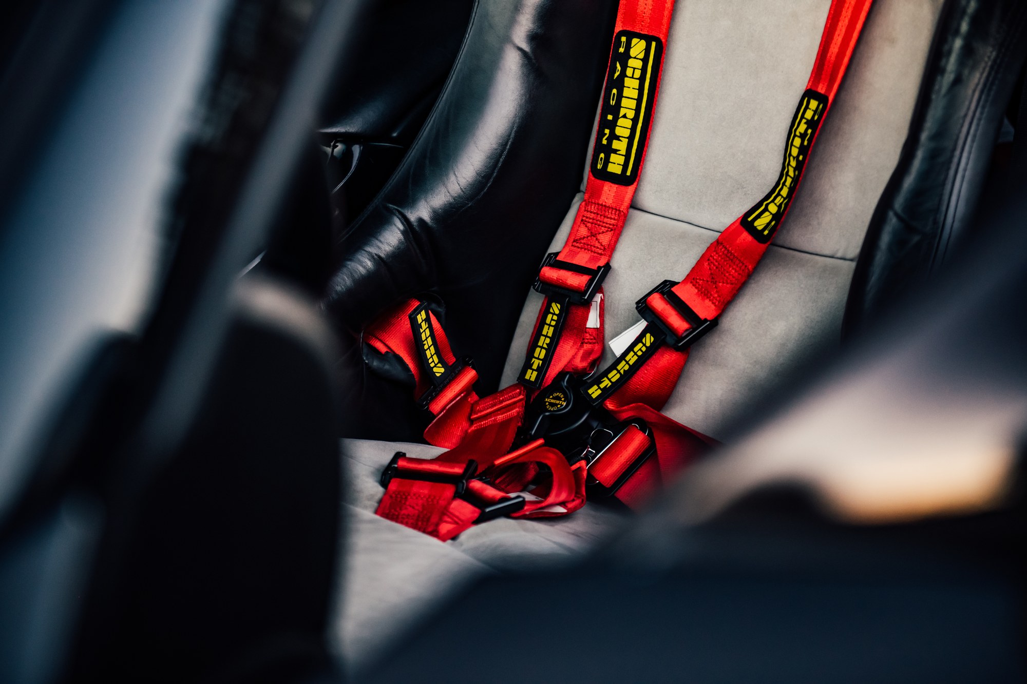 Porsche 911 GT3 racing harness detail, track-spec interior photography by Sharplite Media, Bay Area