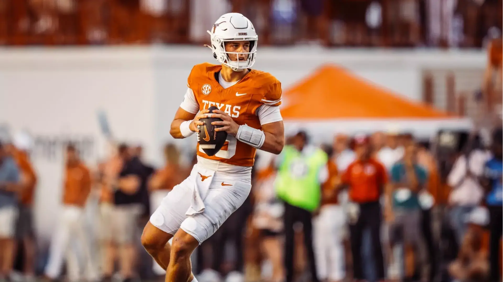 Arch Manning #16 of the Texas Longhorns dropping back to pass