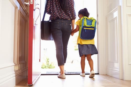 Parent and child heading to school