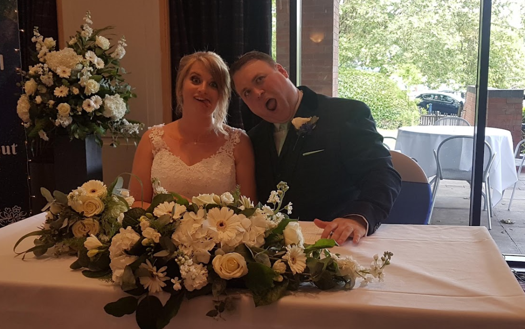 Paula and Daniel at the wedding table