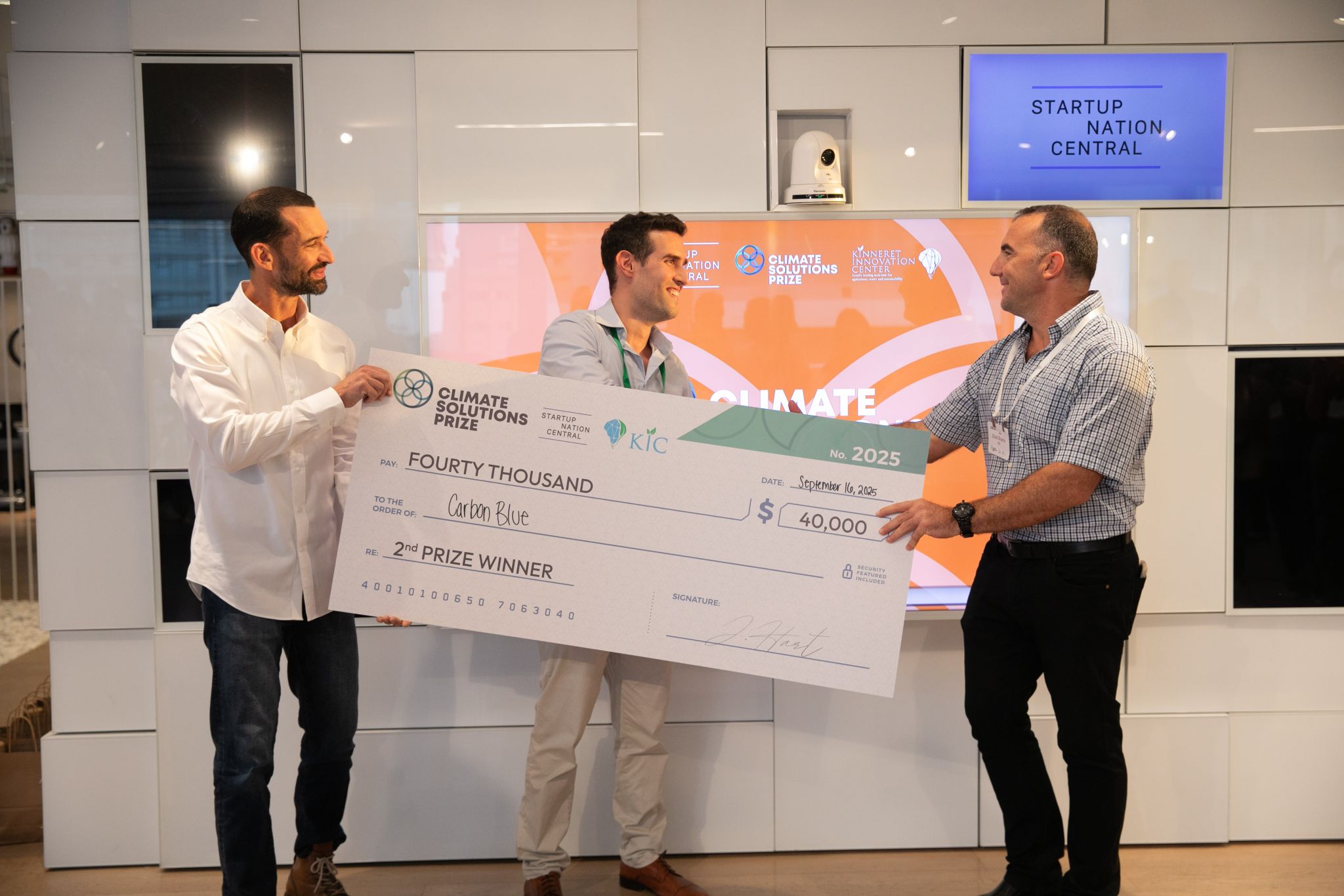 CarbonBlue receiving the 2nd place check at the 2025 Dealroom
