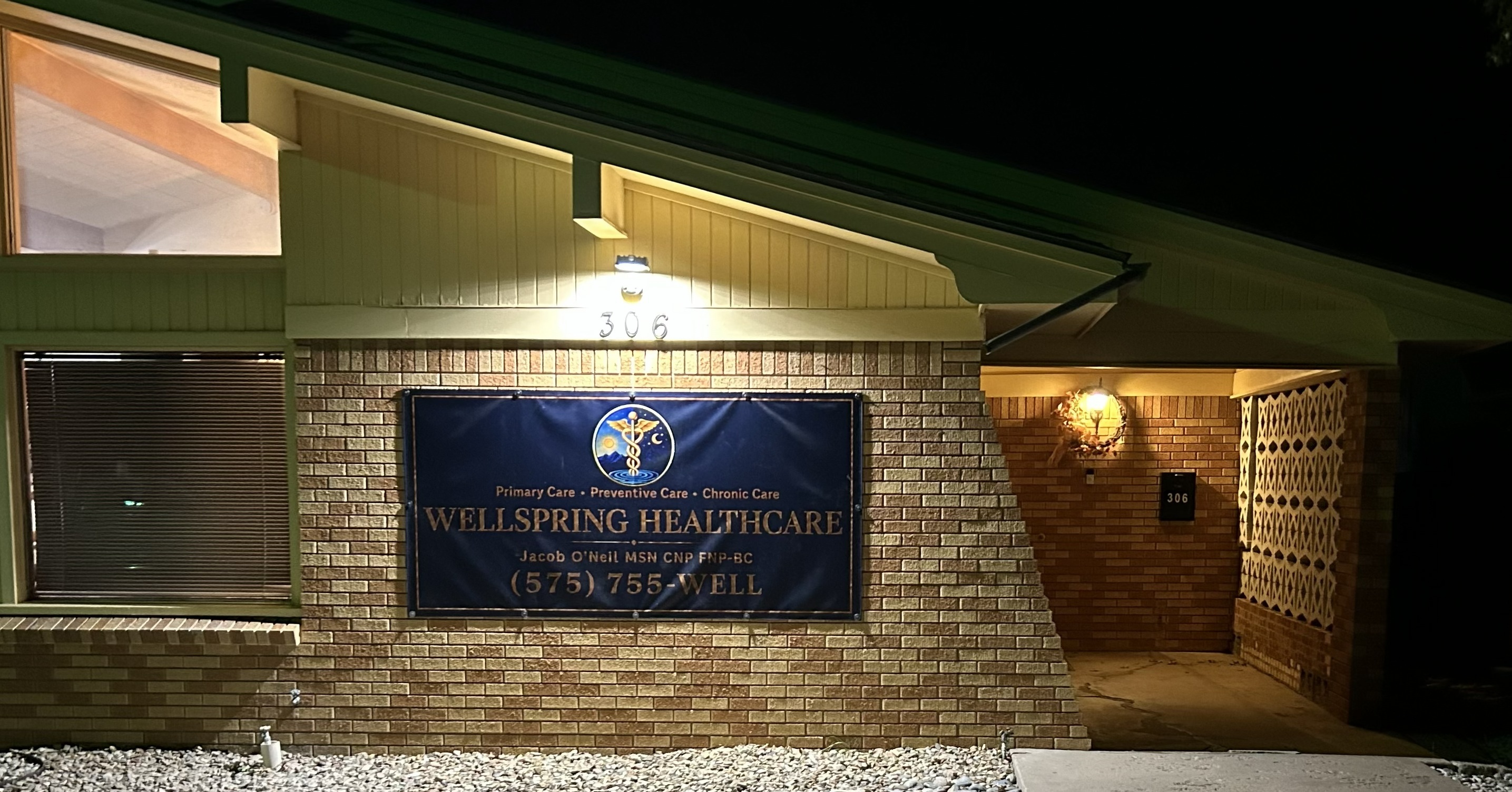 Wellspring Healthcare building exterior with illuminated sign at 306 W. Tilden St, Roswell, NM
