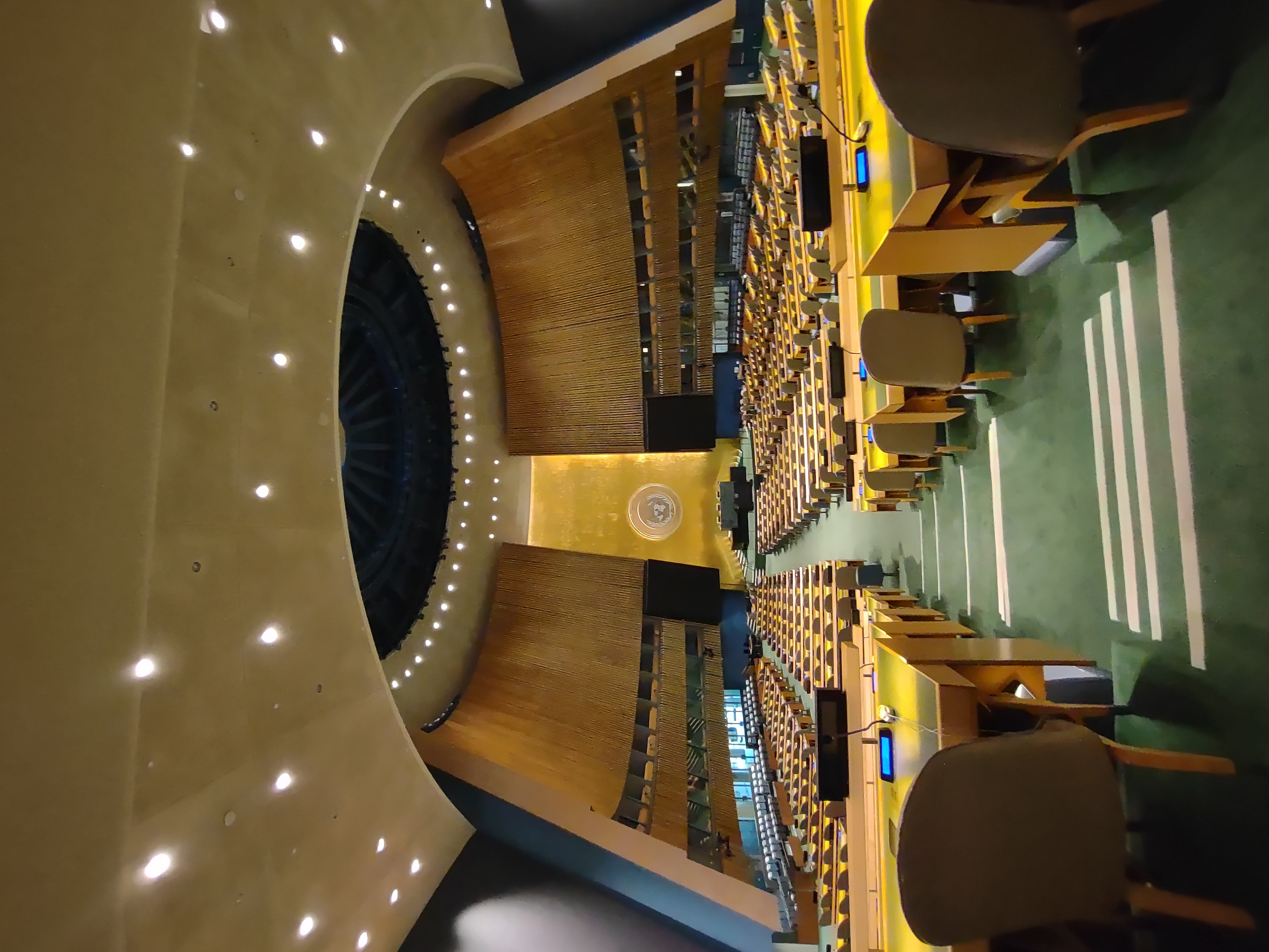 Wide angle view of delegate desks in the United Nations General Assembly Hall
