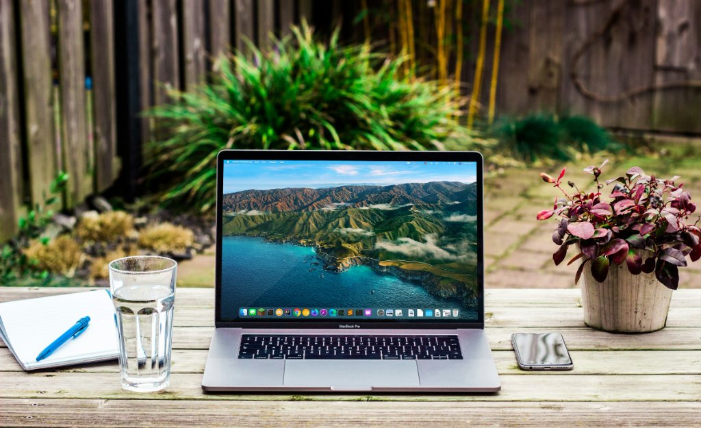 Laptop in a green garden — sustainable remote working