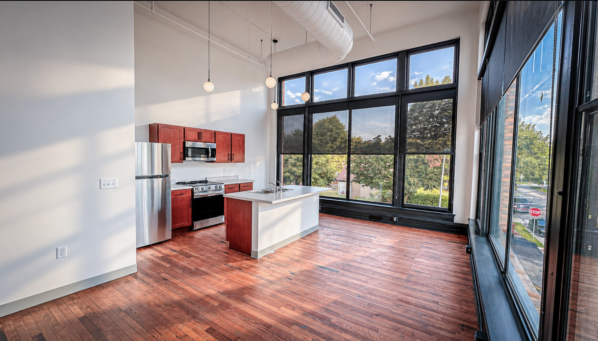 ThriveOn King Residences kitchen with floor-to-ceiling windows