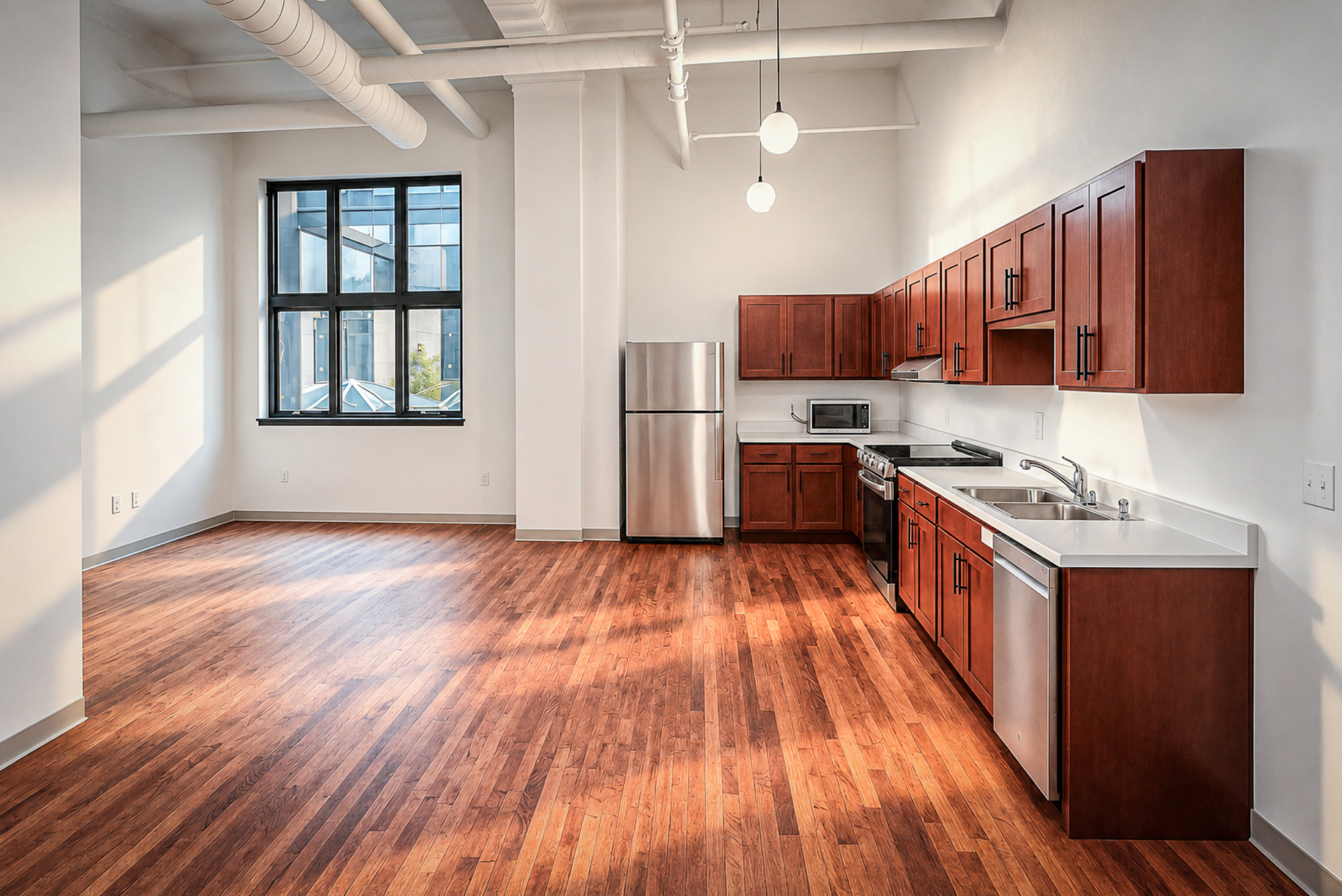 ThriveOn King Residences kitchen with exposed ductwork