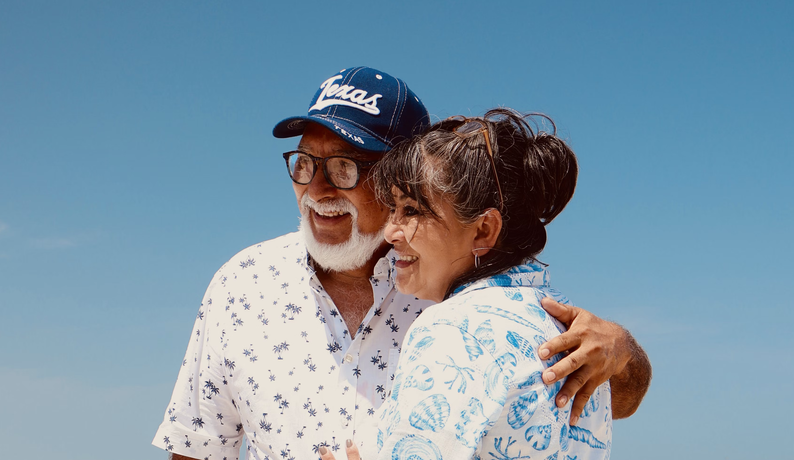 Elderly couple embracing outdoors