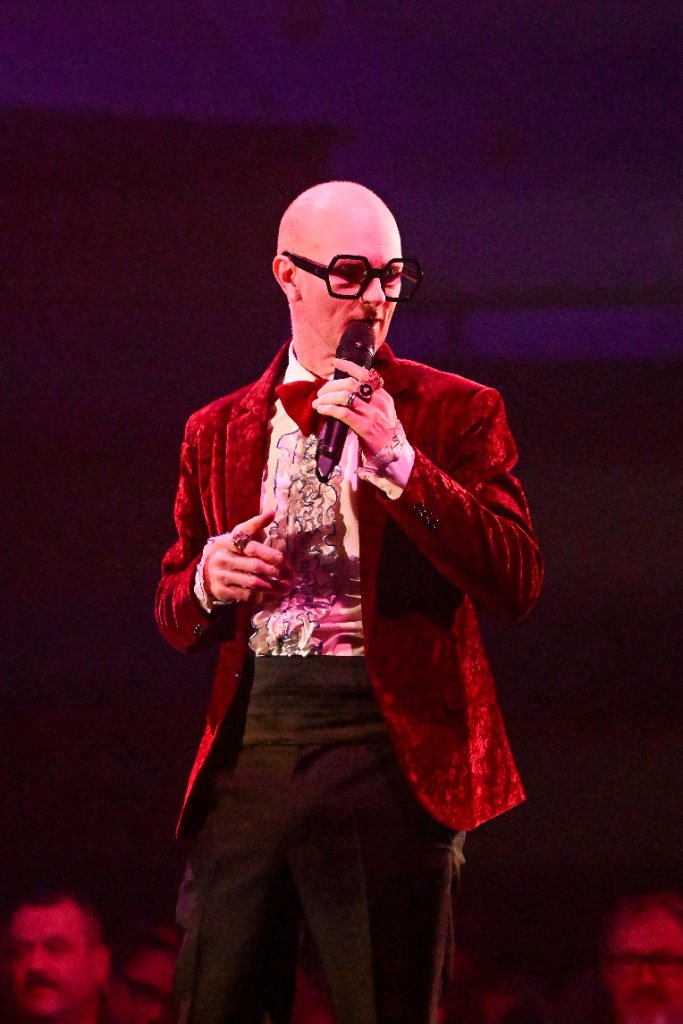 Tixzar founder on stage performing at a live cabaret show