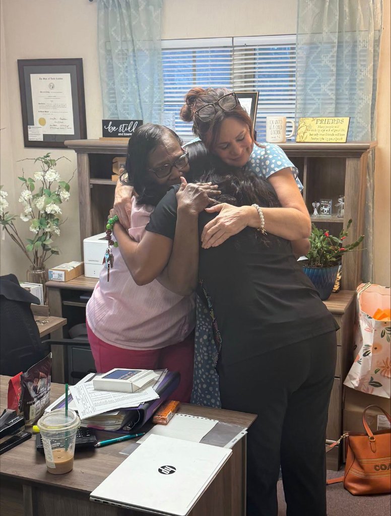 Alliance Health Group staff member cutting a celebratory cake for Administrators Week 2026.