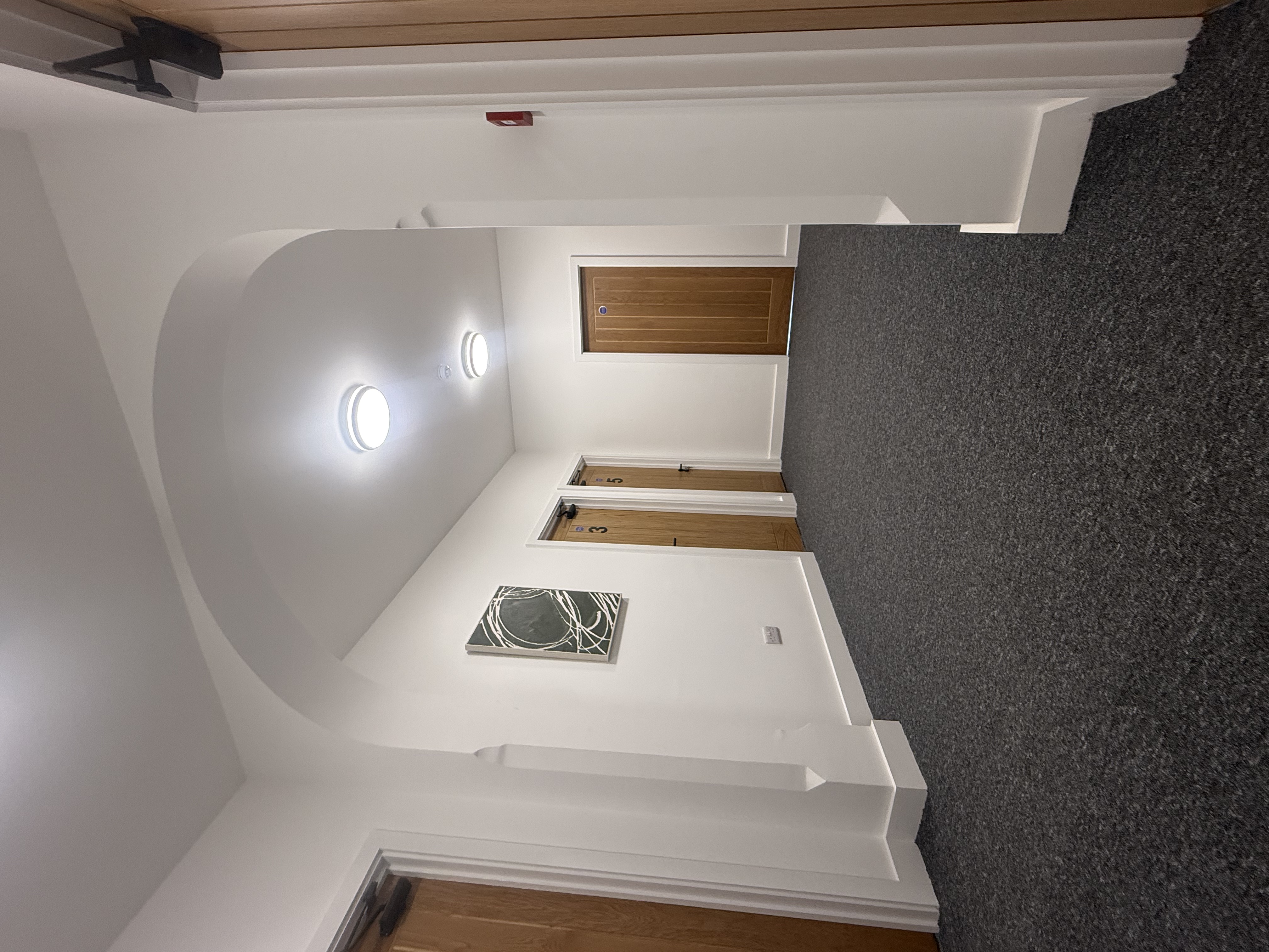Communal hallway with arched doorway