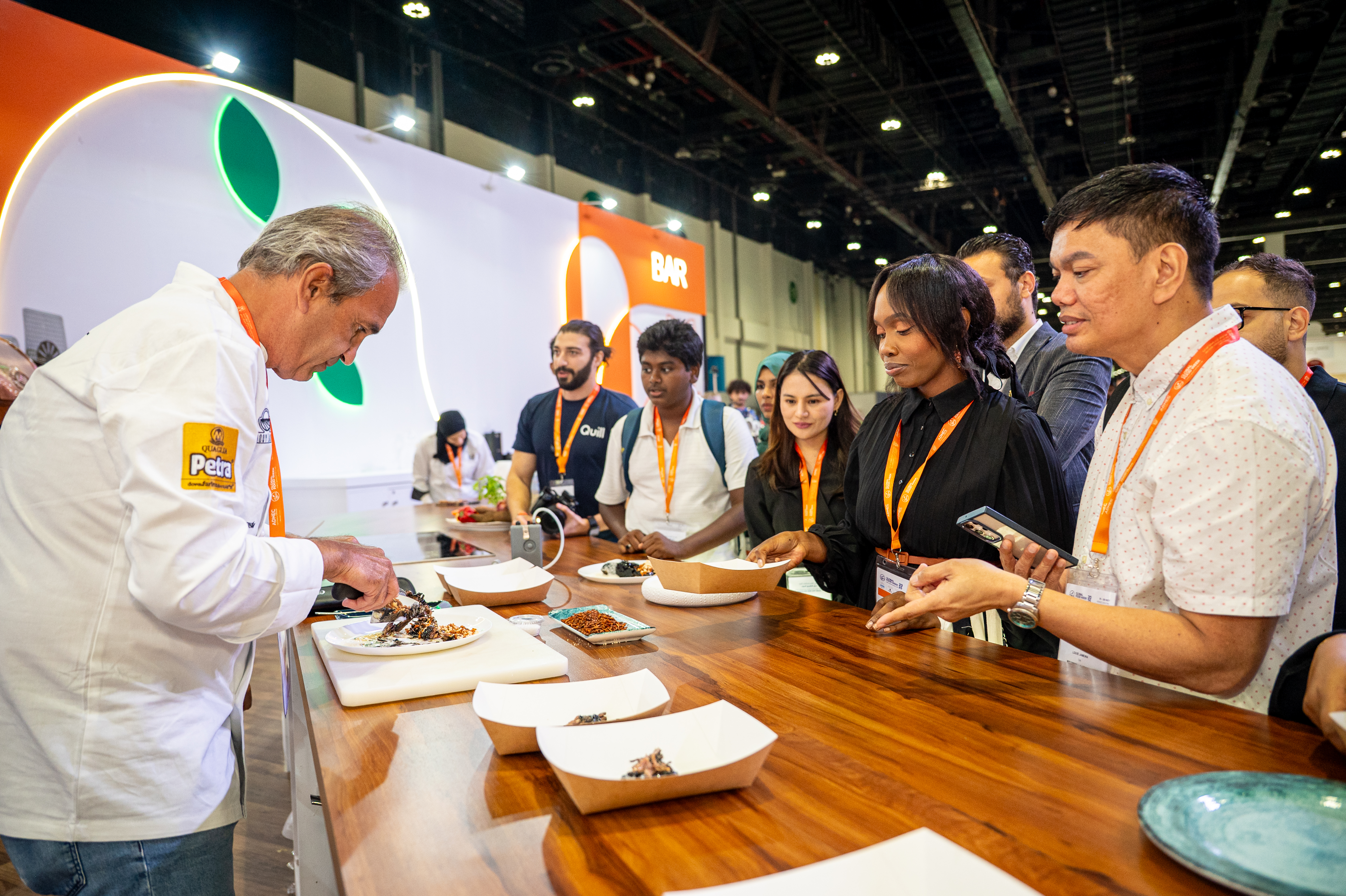 Chef serving guests at the counter
