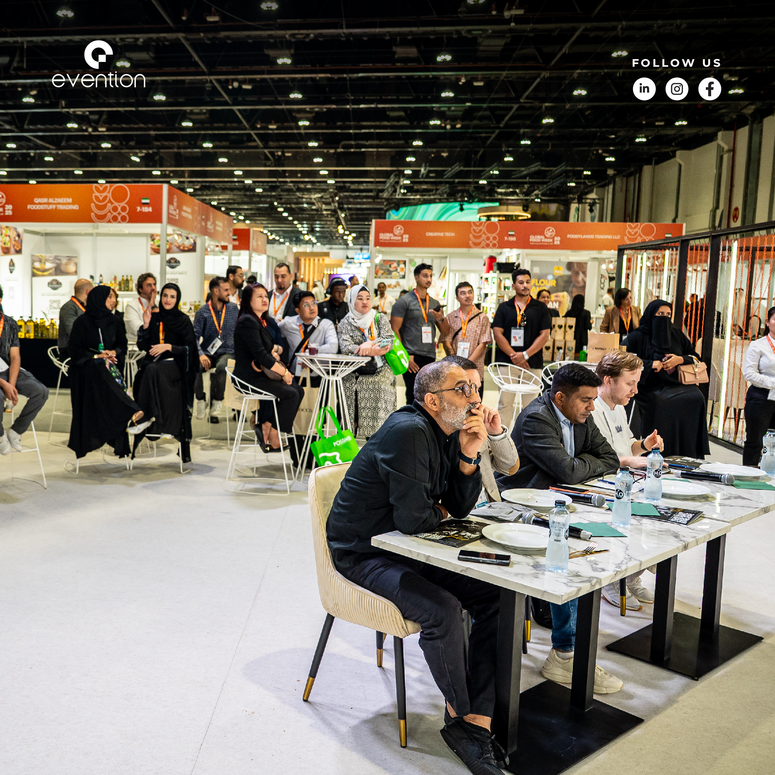 Branded World Gourmet Show 2025 booth with hosts and demo counter