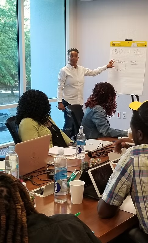 Coach Swan coaching a sales team