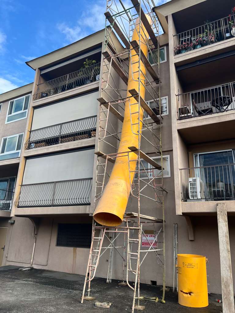 Custom debris chute system