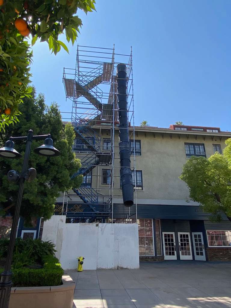 Scaffolding stair tower with trash chute hybrid system