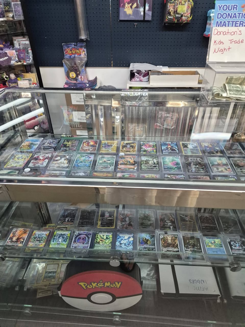 Glass display case of Pokémon singles