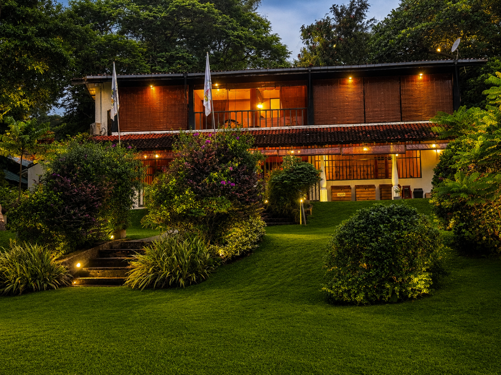 Forest Family Retreat villa exterior at dusk