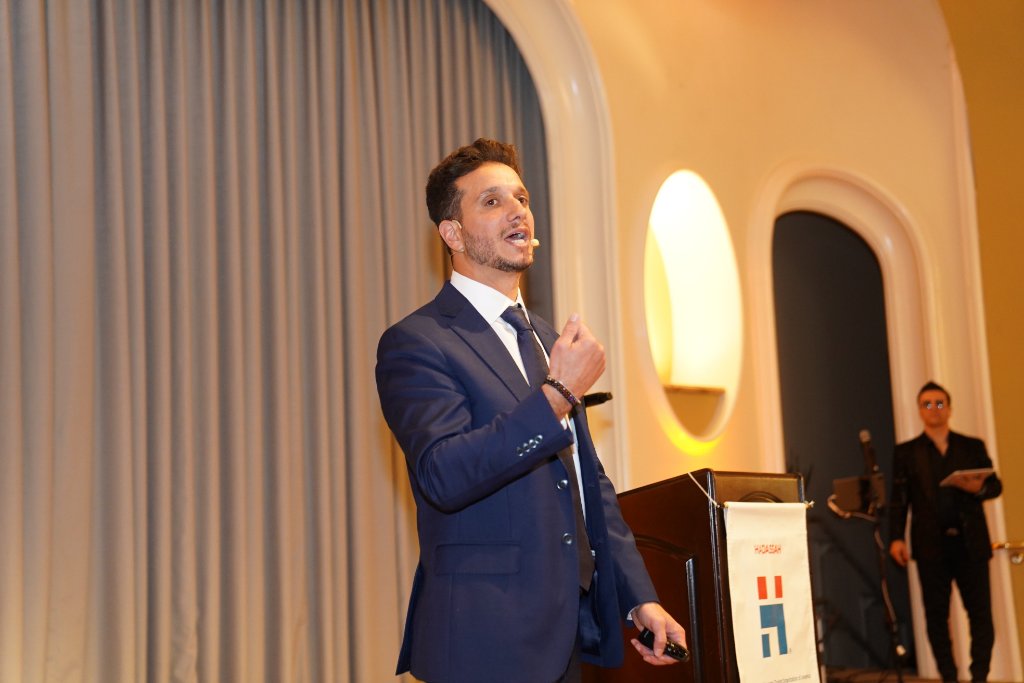 Yoni Asseraf delivering a keynote speech at a Hadassah event