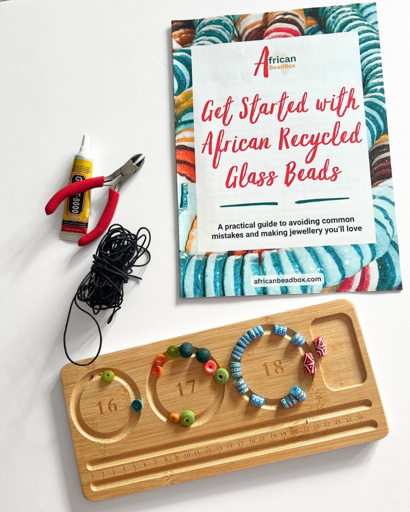 Get Started with African Recycled Glass Beads guide with beading tools and beads on a wooden tray