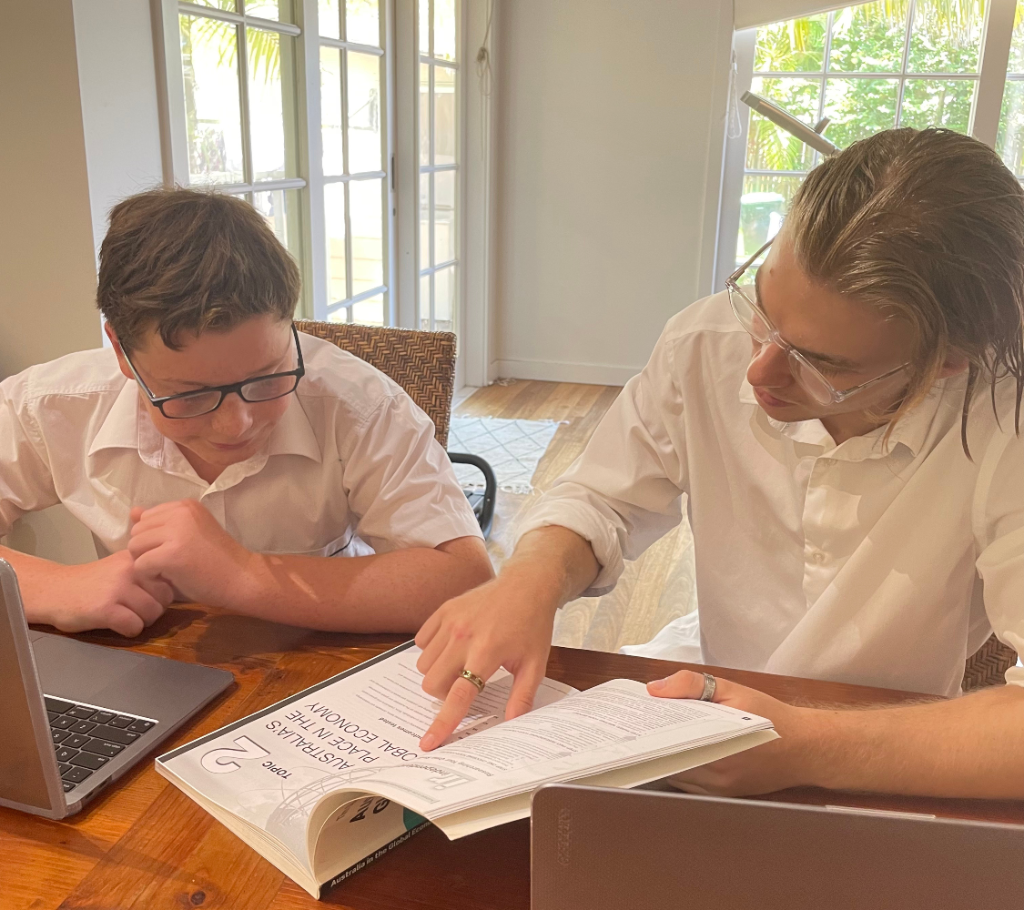 Headstart Tuition tutor working with a student at a table in Mona Vale