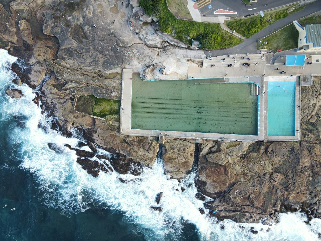Aerial view of Dee Why rock pool complex with the ocean pool, kiddie pool and rocky shoreline