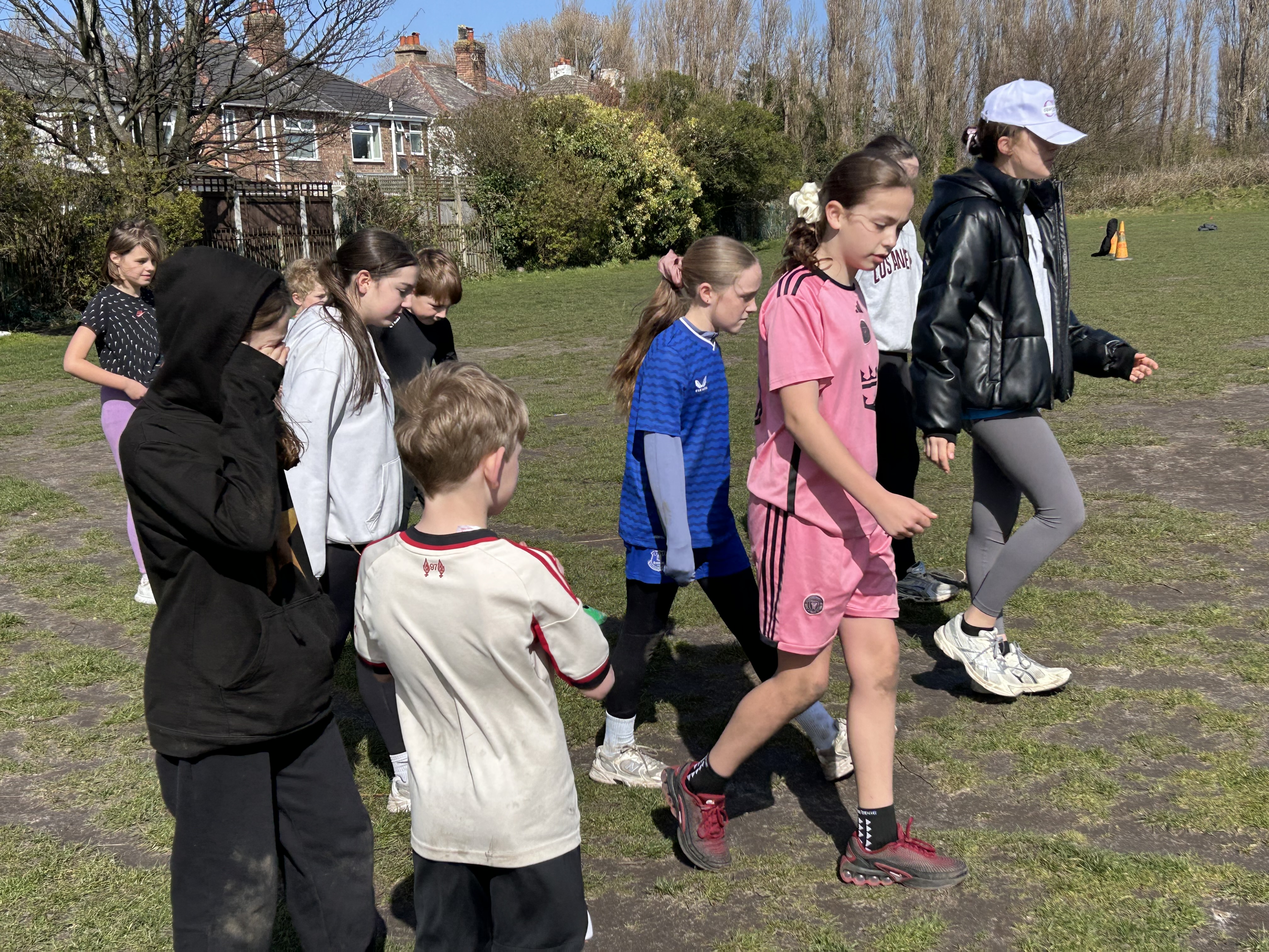 Young leaders leading a group activity on the school field