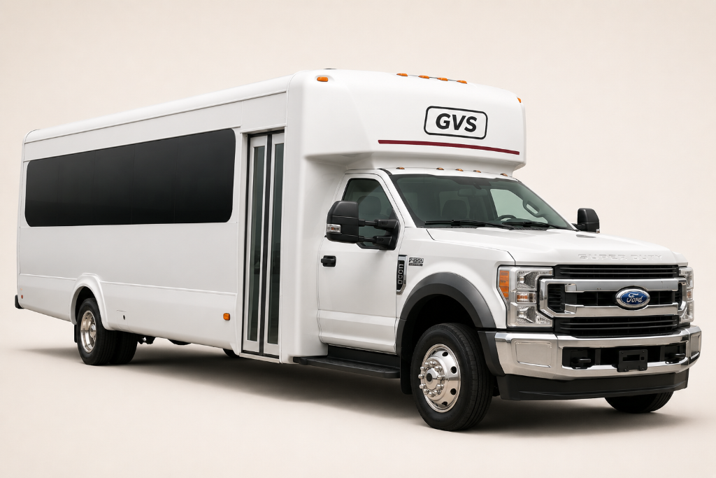 White Ford F-550 Super Duty shuttle bus, F-series chassis with truck-style front end, seamless side windows, GVS bulkhead mark above windshield with red accent line.
