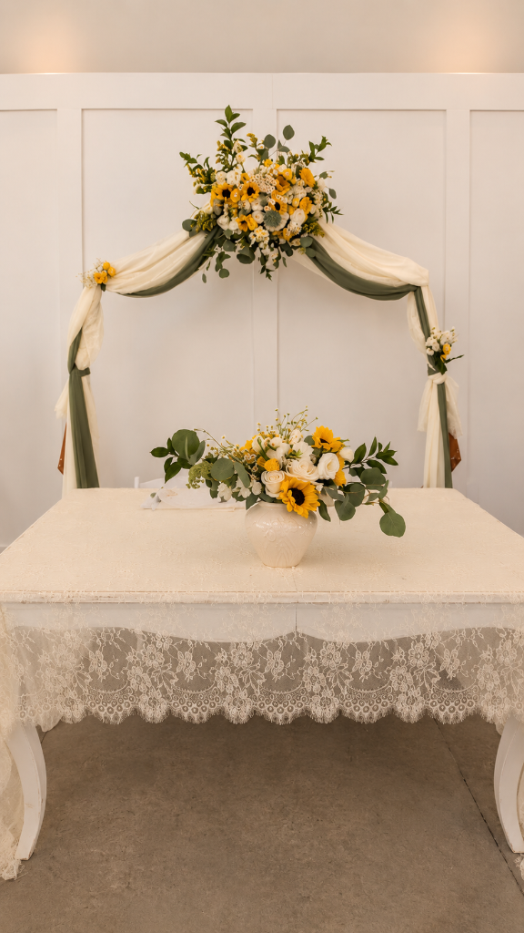 Sweetheart table styling with soft draping and cheerful florals