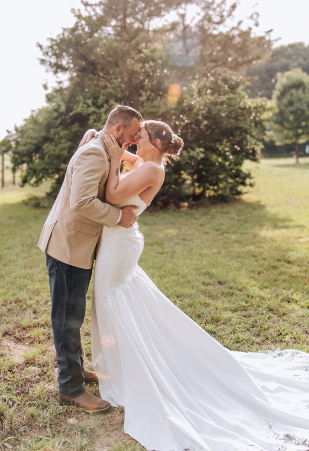 A sunlit portrait of the couple sharing a quiet moment together.