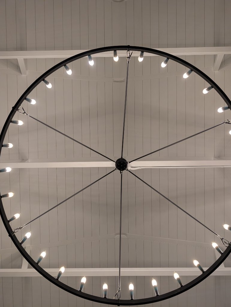 Our modern chandelier casts a warm glow for your evening.