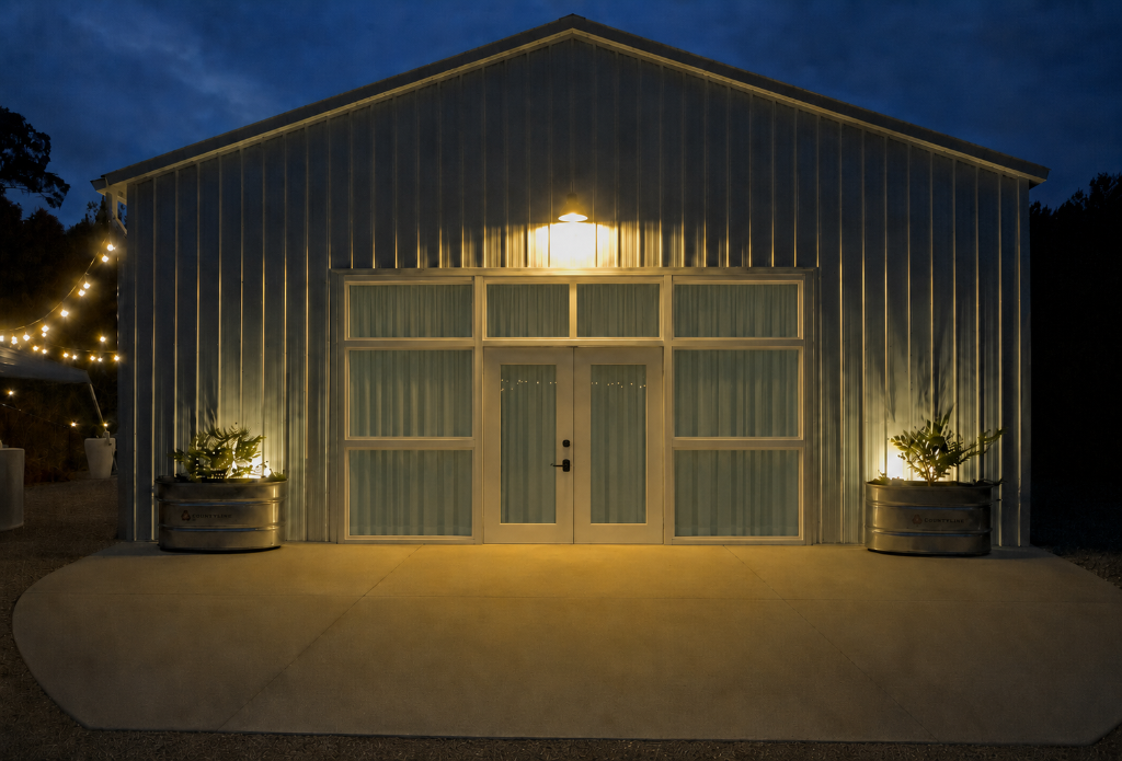 The barn glowing warmly at night