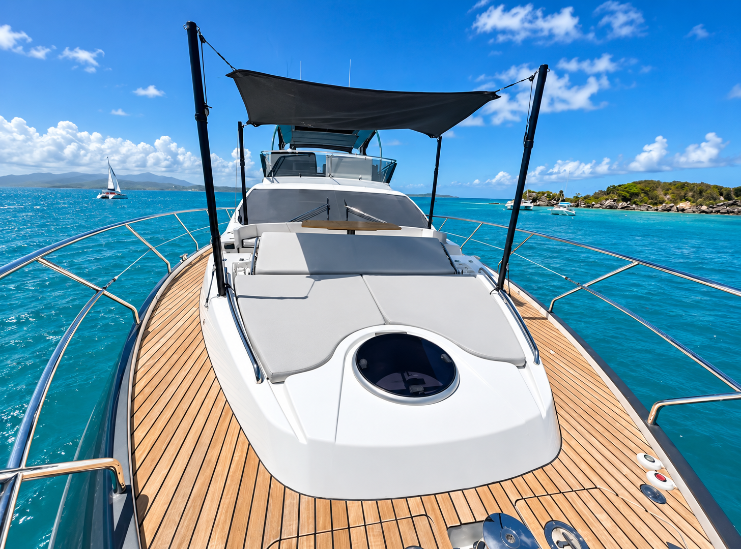 66' luxury yacht bow sun lounge overlooking turquoise Caribbean waters off Puerto Rico
