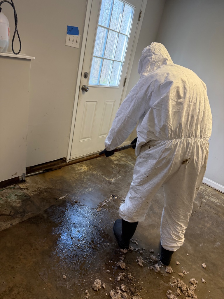 Asbestos flooring and mastic removal — scraping and wet abatement