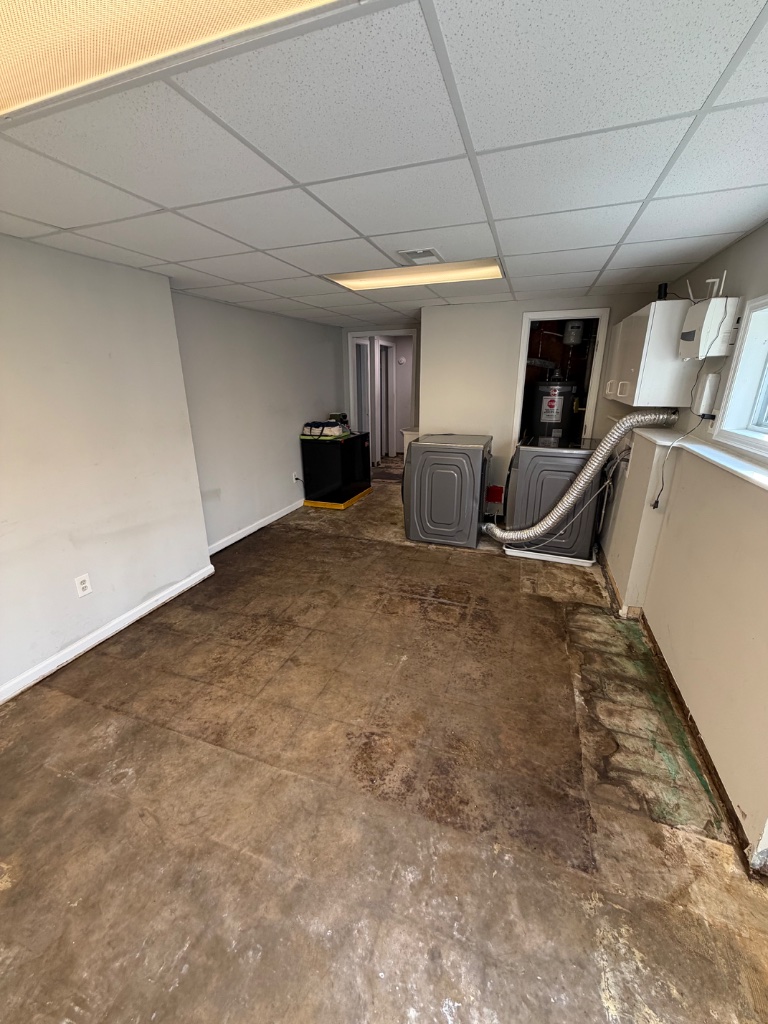 Asbestos floor tile removal — completed abatement area