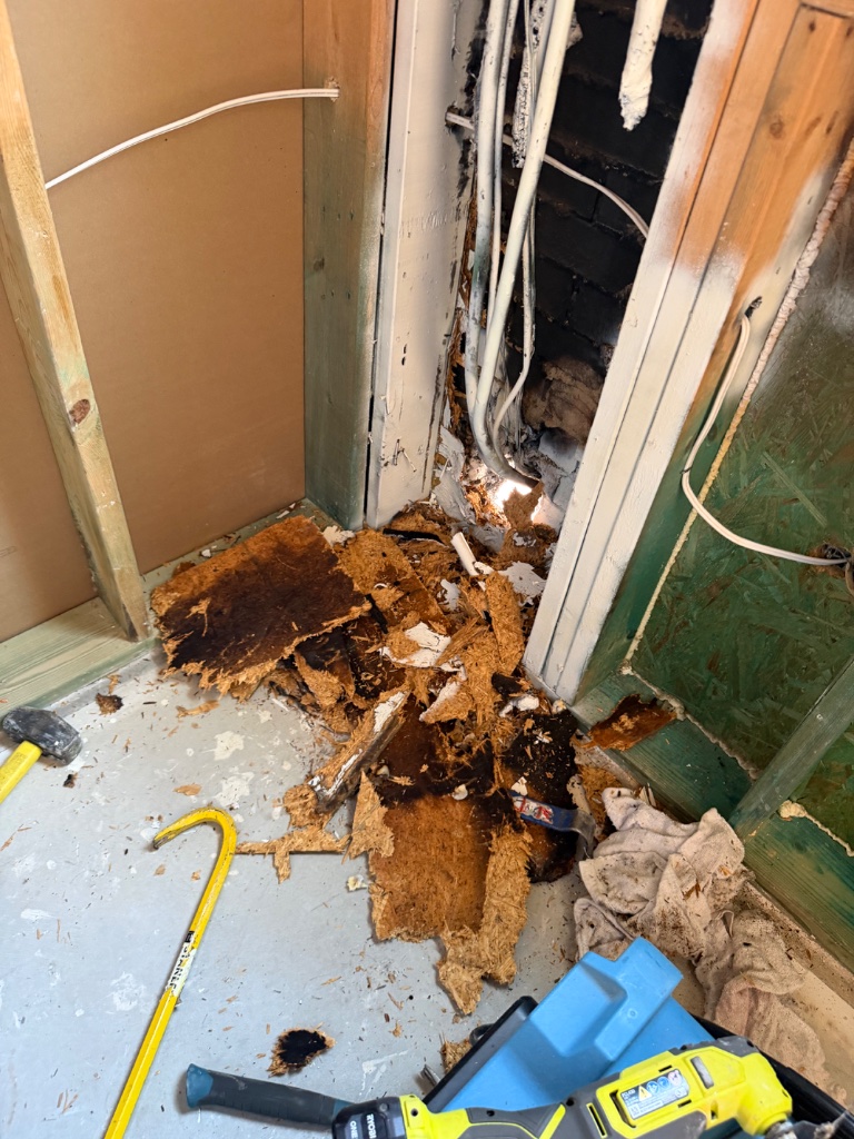 Fire damage debris removal — burned materials and framing