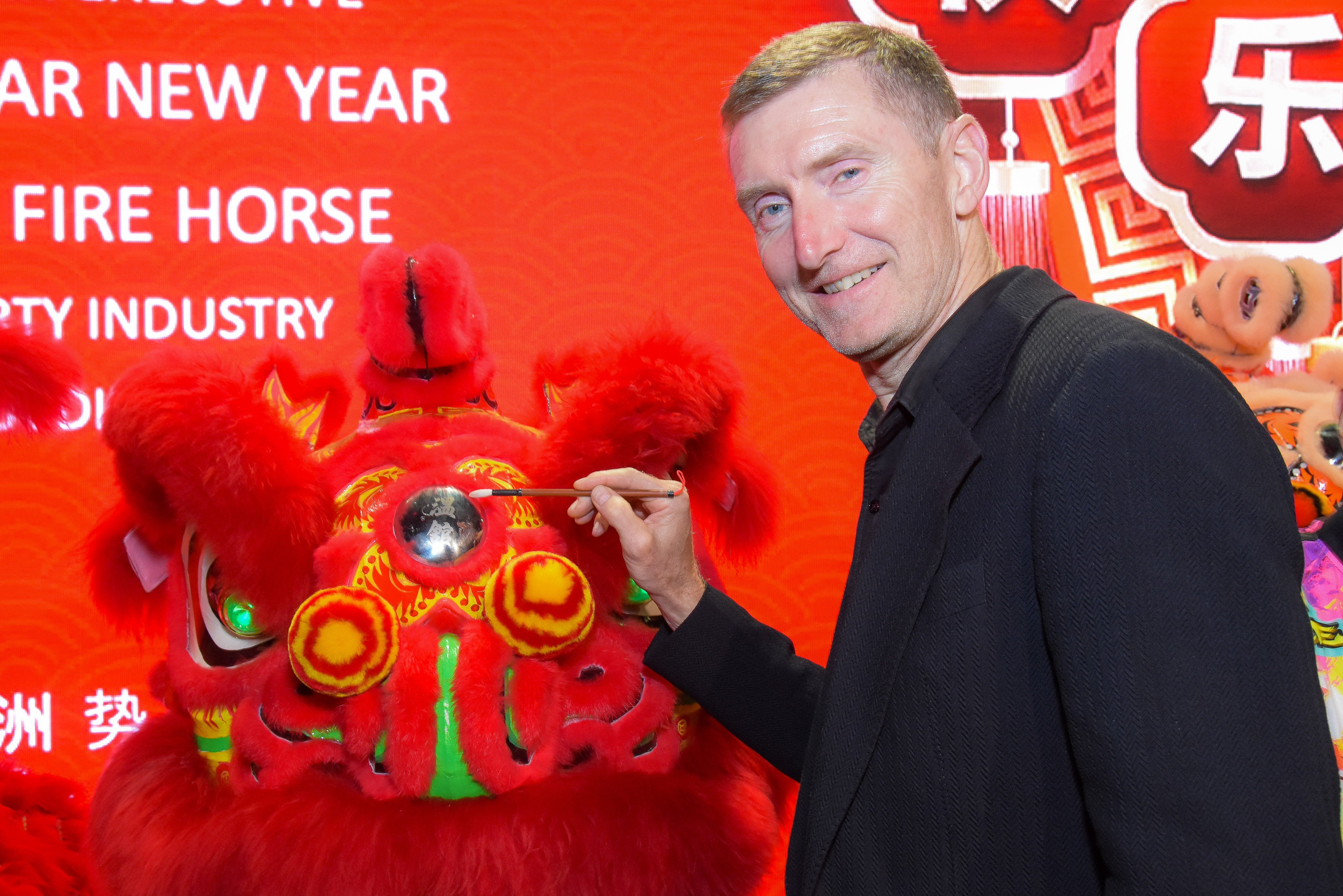 Guest performing the lion-dotting ceremony at the 2026 Lunar New Year Gala
