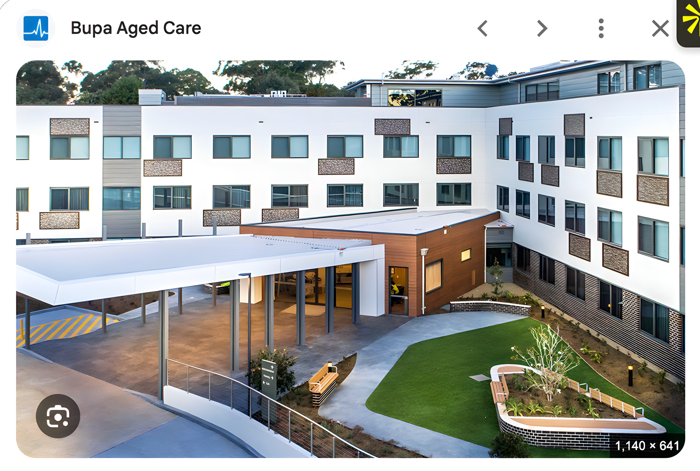 Contemporary Bupa aged care facility with landscaped courtyard and covered entrance