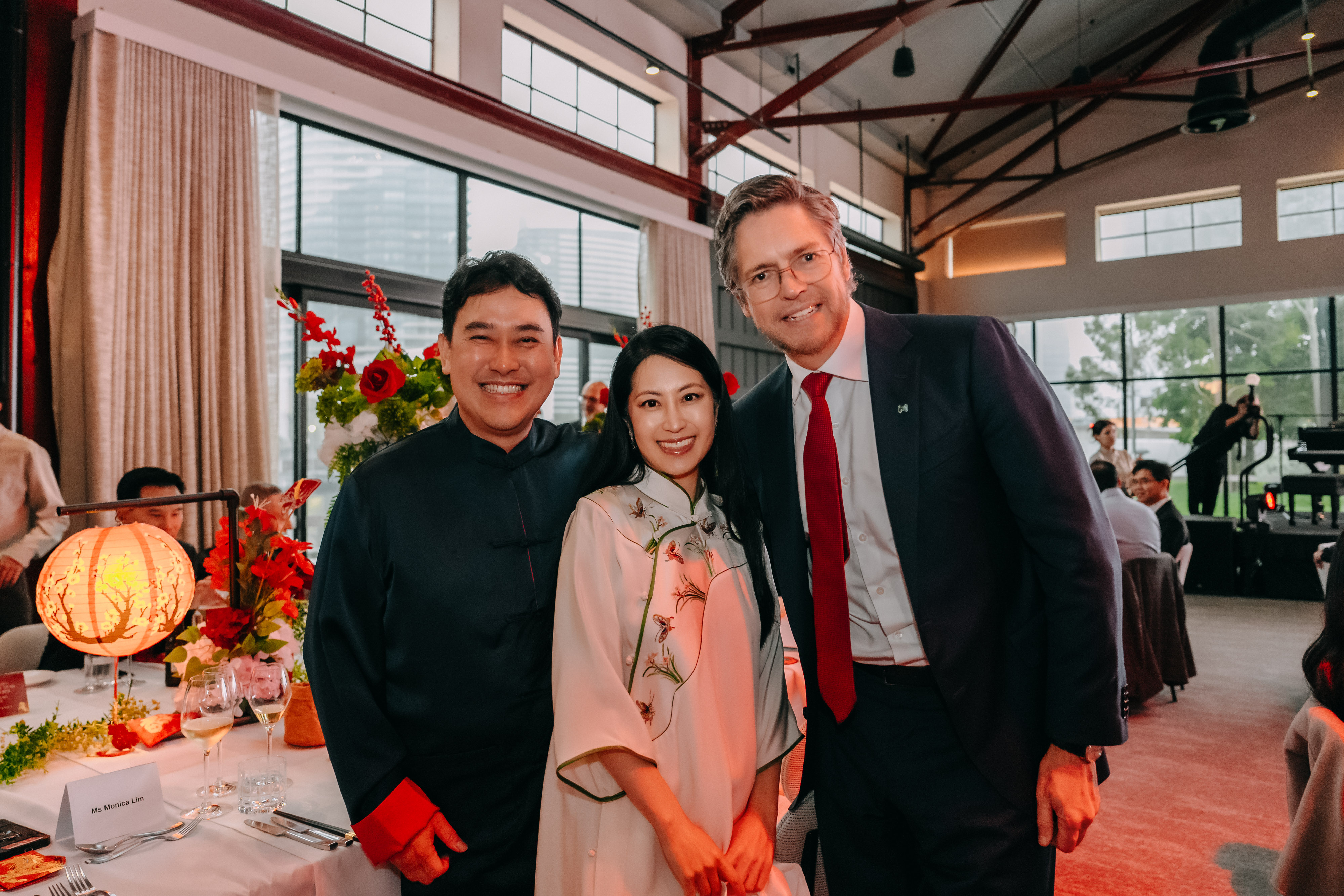 Three guests posing together at the 2026 Lunar New Year Gala