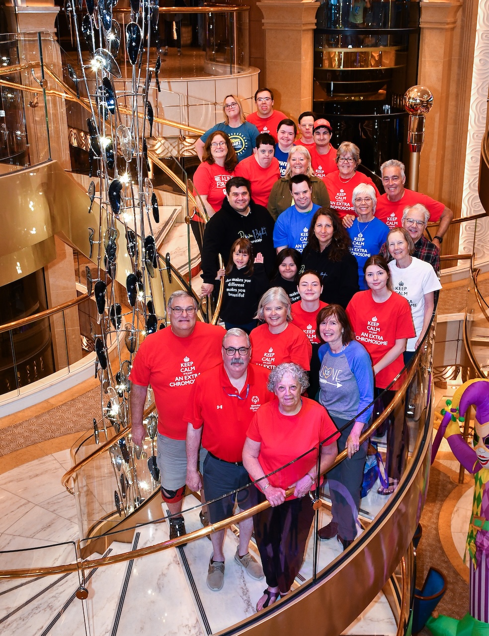 21Wave community cruise group on the ship's grand staircase