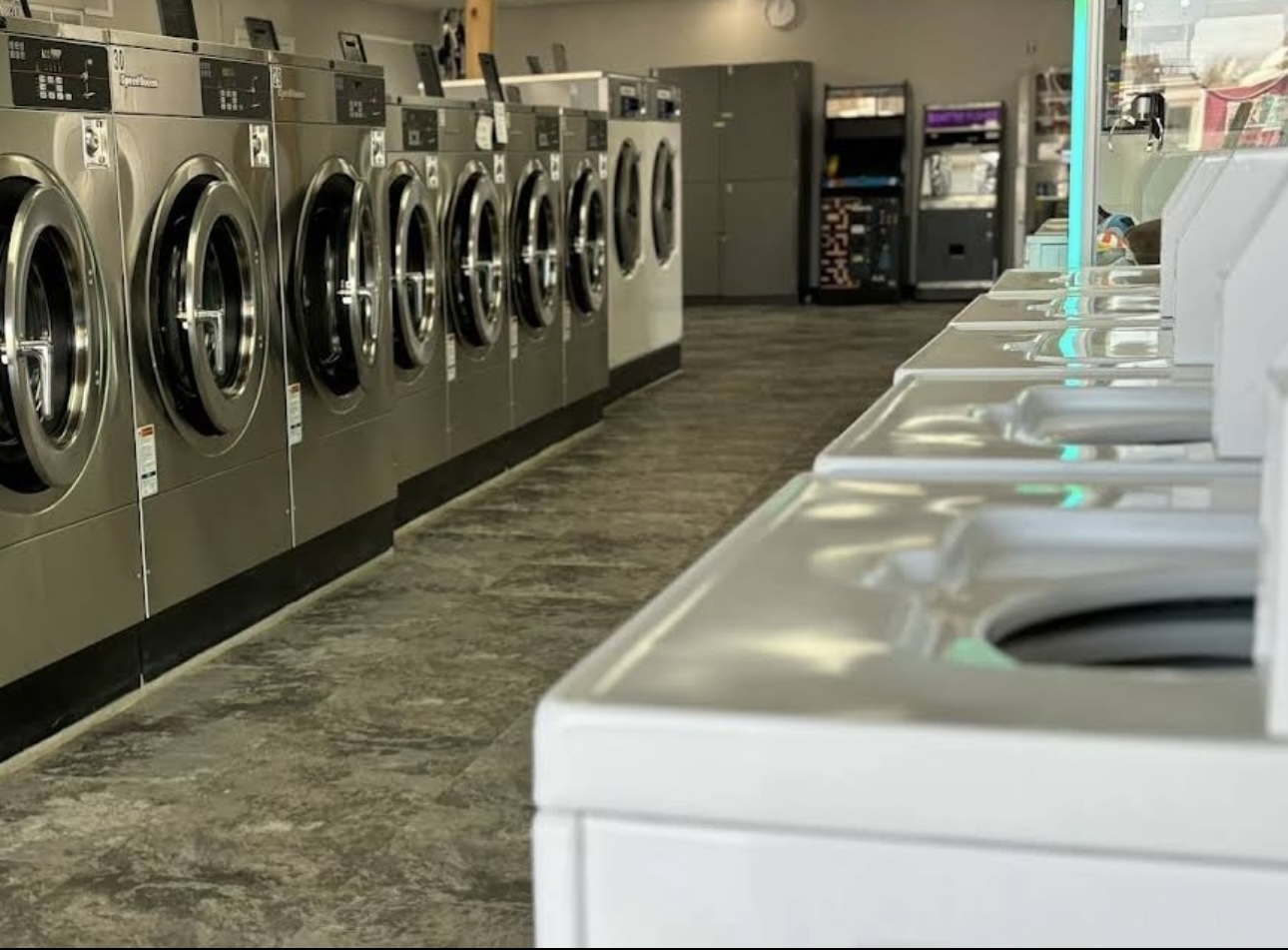Quik Wash laundromat with washers and folding stations