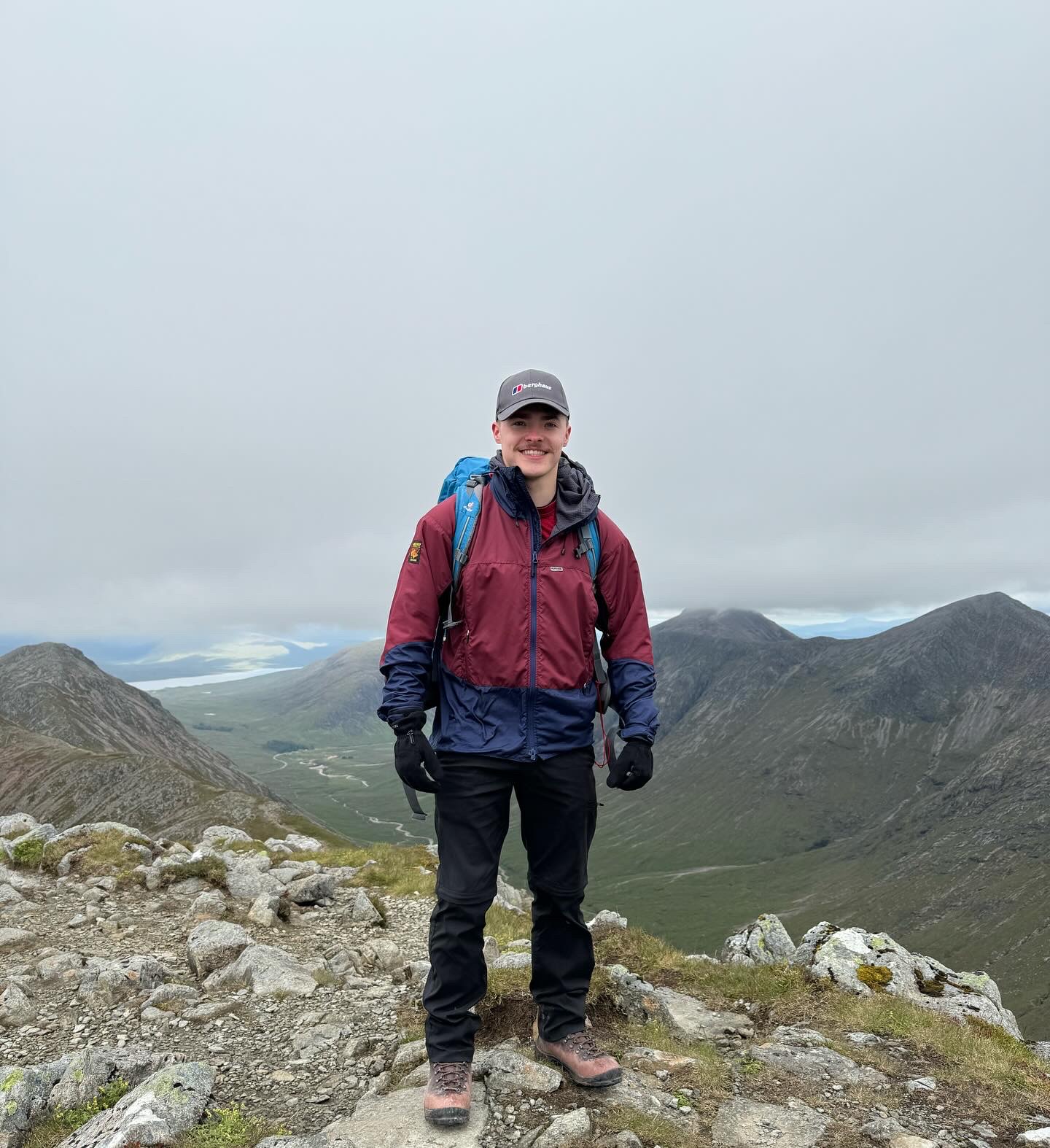 Ben Davies, founder of FleetForge, on a mountain summit