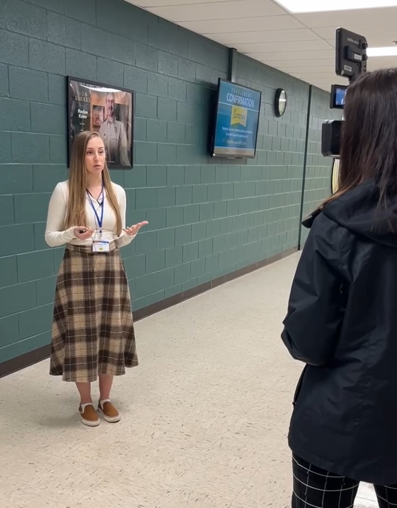 Stephanie being interviewed after a presentation