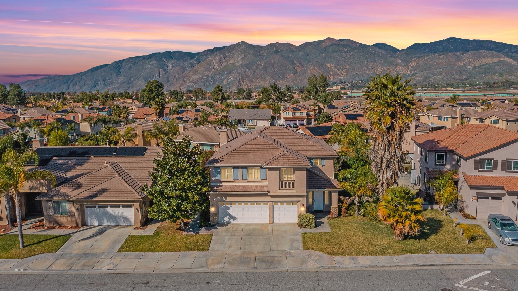 Home exterior at twilight with glowing windows