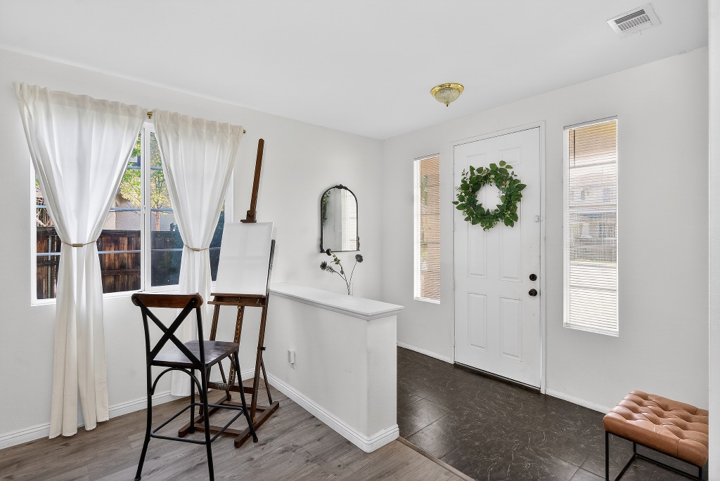 Bright entryway with wreath and staging decor