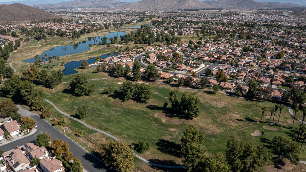 Aerial view of golf course and neighborhood